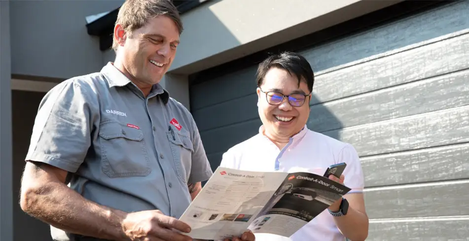Happy Customer looking at Garage Door Manual
